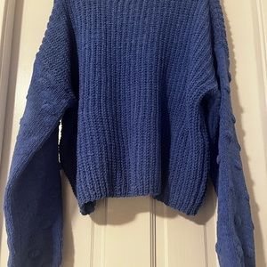 Royal blue sweater with polka dots on sleeves. Size small